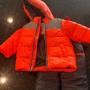 Brand new 12month size snow bibs with matching jacket.